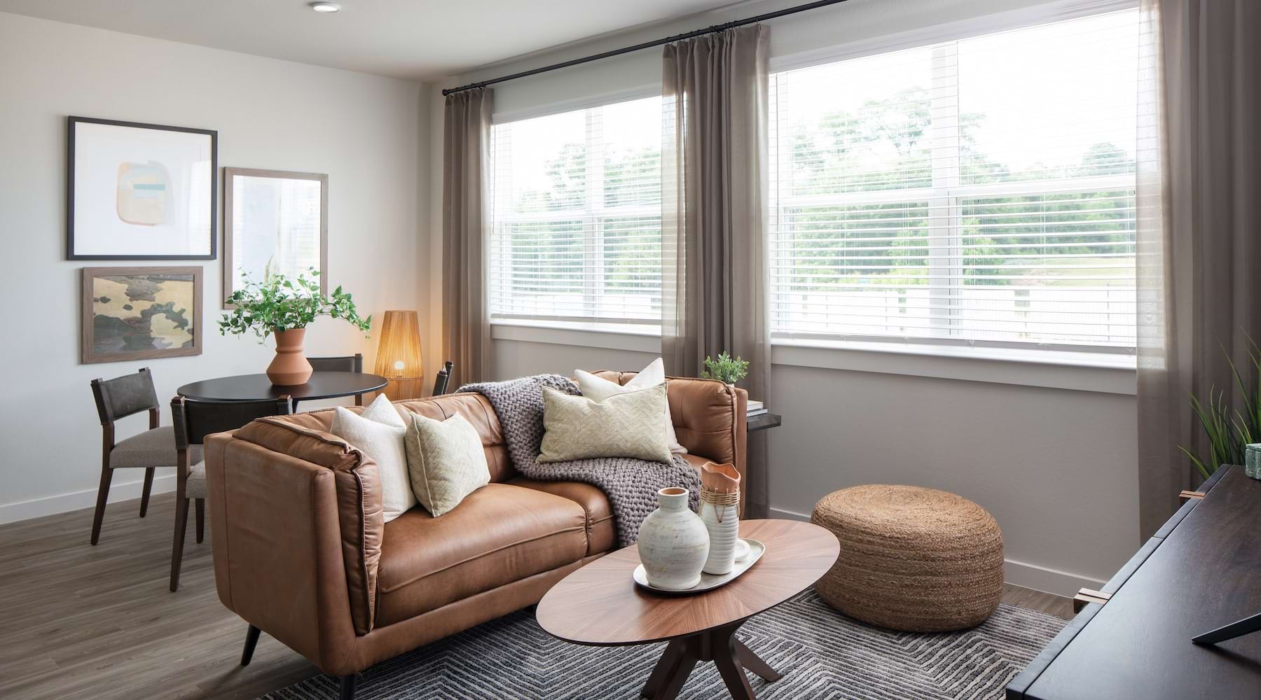 living room with ample natural lighting from large windows