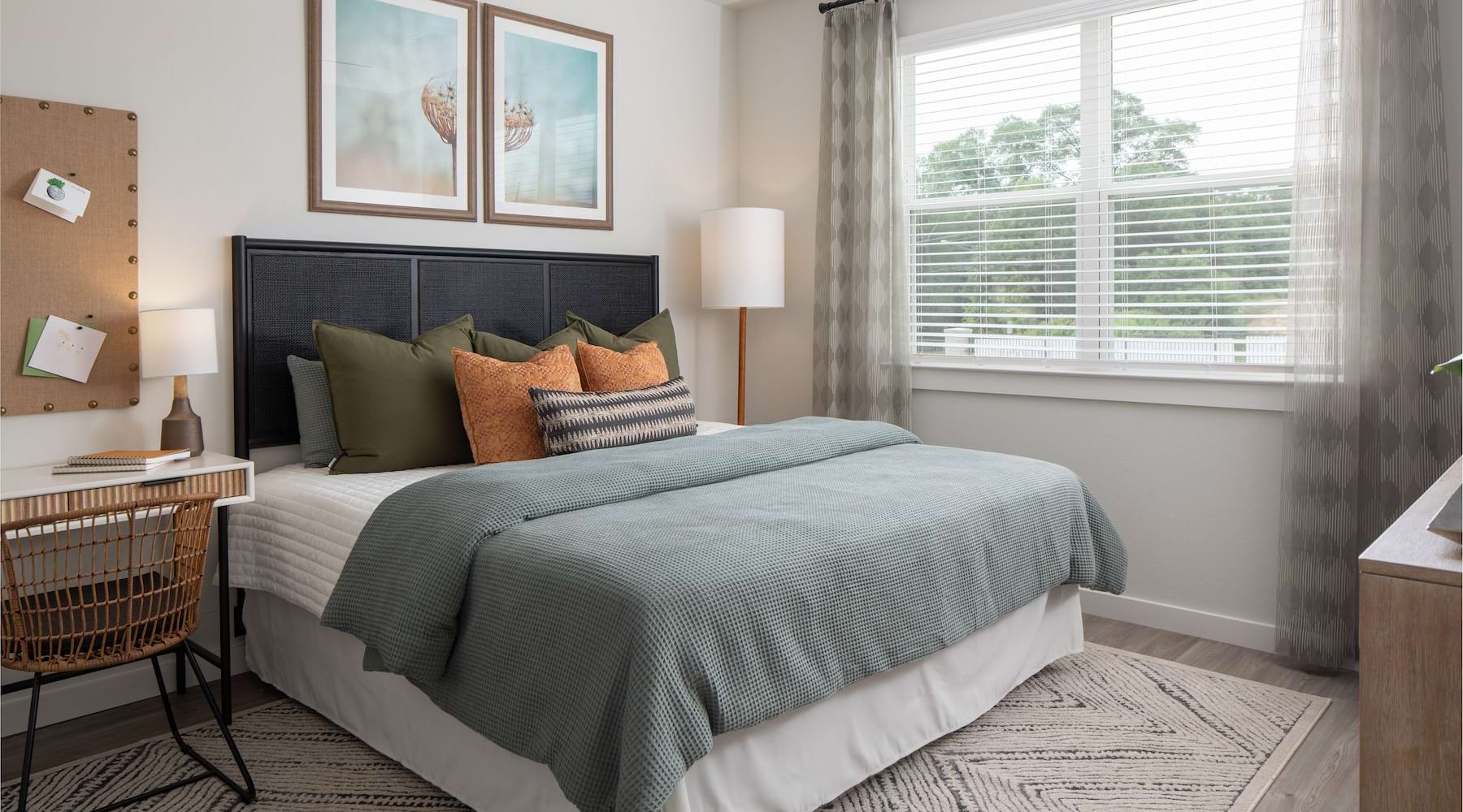 bedroom with a large window and modern decor